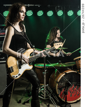 Women playing in the rock band 28744399