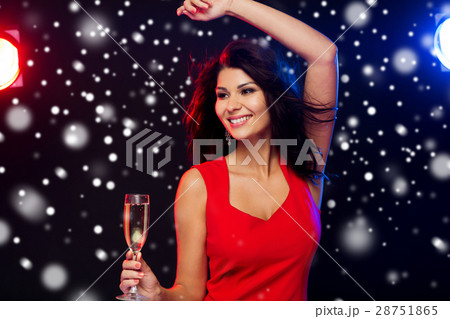 beautiful woman with champagne glass at nightclub 28751865