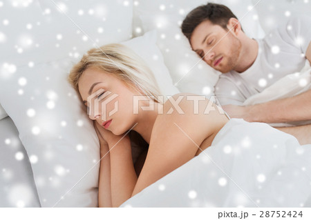 happy couple sleeping in bed at home happy couple sleeping in bed at home 28752424