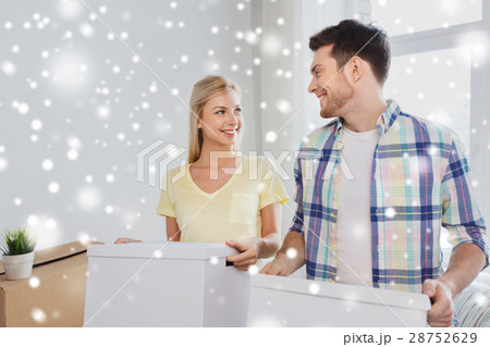 smiling couple with big boxes moving to new home smiling couple with big boxes moving to new home 28752629