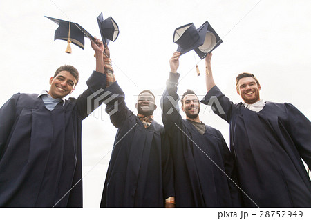 happy students or bachelors waving mortar boards 28752949