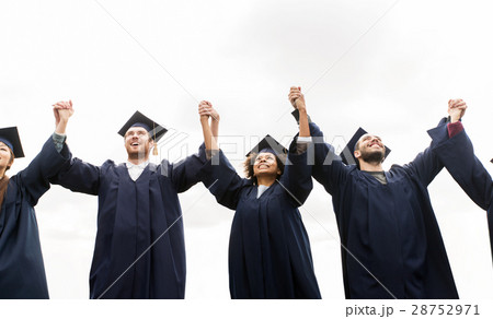 happy students or bachelors celebrating graduation 28752971
