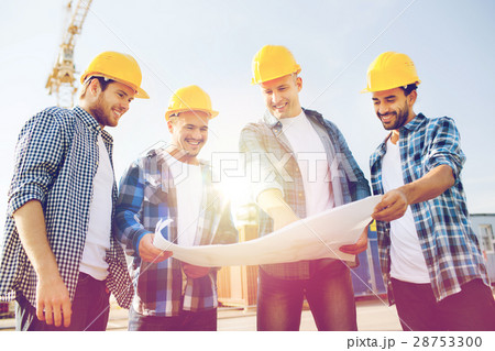 group of builders with tablet pc and blueprint group of builders with tablet pc and blueprint 28753300