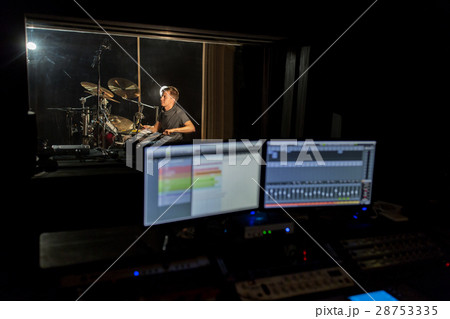man playing drum kit at sound recording studio 28753335