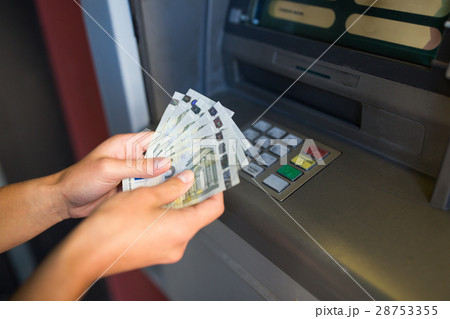 close up of hand withdrawing money at atm machine close up of hand withdrawing money at atm machine 28753355