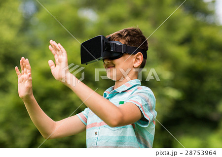 boy with virtual reality headset outdoors 28753964