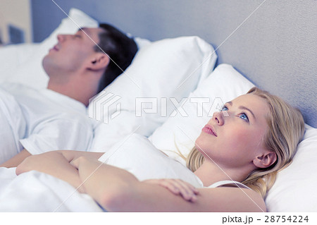happy couple sleeping in bed 28754224