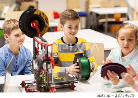 happy children with 3d printer at robotics school 28754679