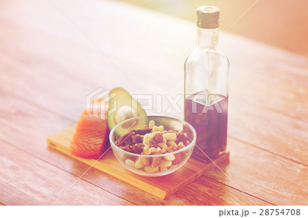 close up of food and olive oil bottle on table 28754708