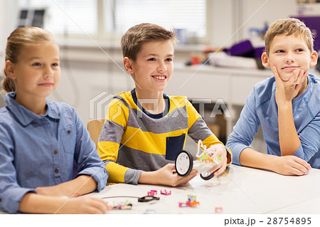 happy children building robots at robotics school happy children building robots at robotics school 28754895