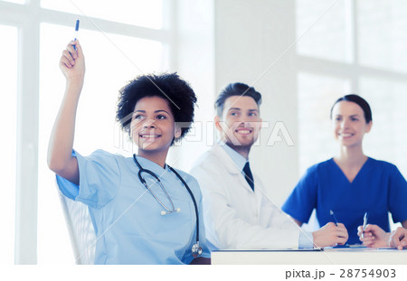 group of happy doctors on conference at hospital group of happy doctors on conference at hospital 28754903