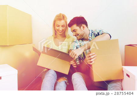 smiling couple with many boxes moving to new home smiling couple with many boxes moving to new home 28755404