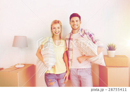 happy couple with stuff moving to new home happy couple with stuff moving to new home 28755411