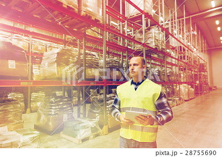 manual worker with tablet pc at warehouse manual worker with tablet pc at warehouse 28755690