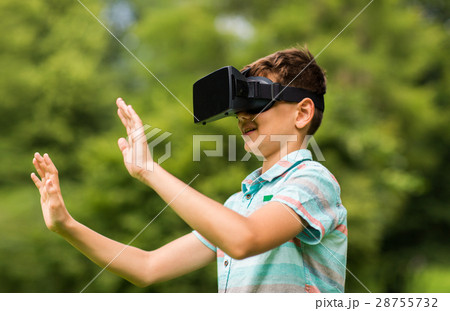 boy with virtual reality headset outdoors 28755732