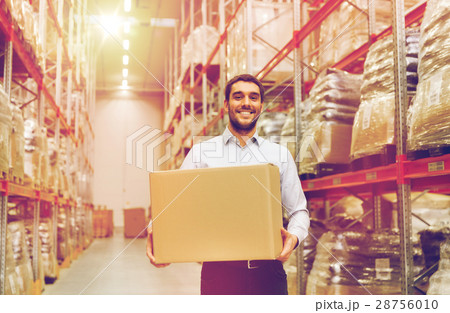 happy man with cardboard parcel box at warehouse happy man with cardboard parcel box at warehouse 28756010