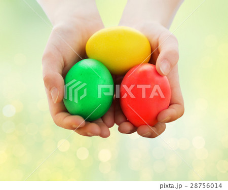 close up of child hands holding easter eggs close up of child hands holding easter eggs 28756014