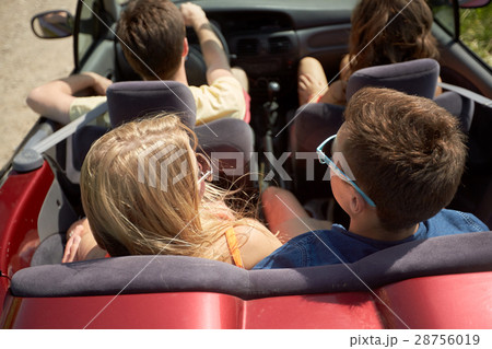 happy friends driving in convertible car at summer happy friends driving in convertible car at summer 28756019
