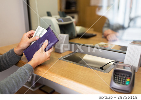 hands with money at bank or currency exchanger 28756118
