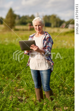 senior woman with tablet pc computer at county 28756451