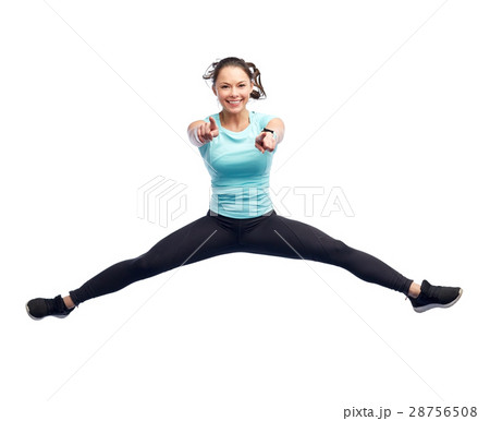 happy smiling sporty young woman jumping in air 28756508