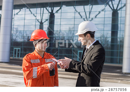boss giving salary in an envelope. cash in hand 28757056