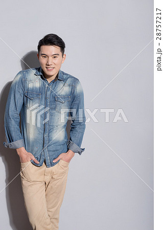 man with gray wall man with gray wall 28757217