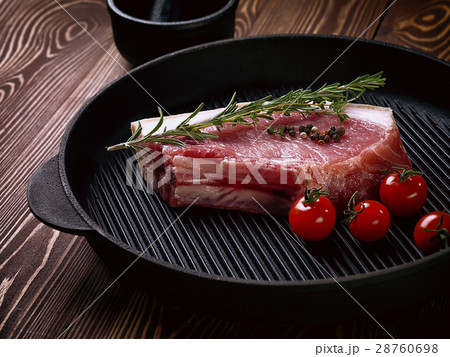 Raw pork steak on ribs. 28760698