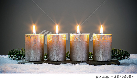 Light four advents candles with matches Light four advents candles with matches 28763687