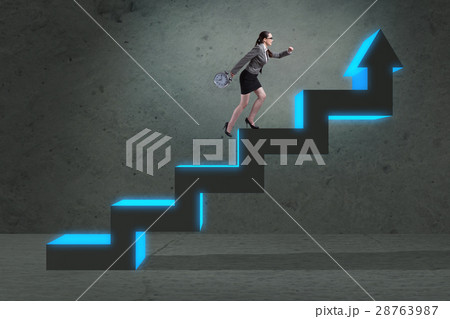 Young businesswoman climbing career ladder Young businesswoman climbing career ladder 28763987