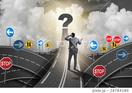 Businessman in uncertainty concept on road Businessman in uncertainty concept on road 28764380