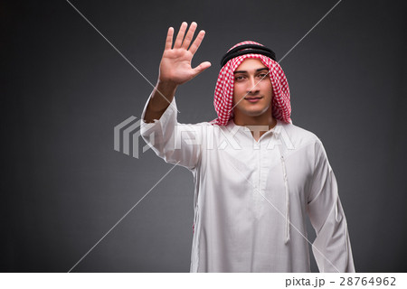 Arab businessman on gray background Arab businessman on gray background 28764962