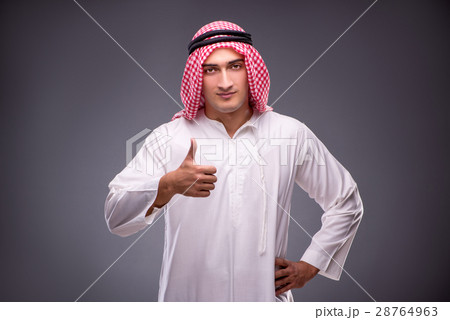 Arab businessman on gray background Arab businessman on gray background 28764963