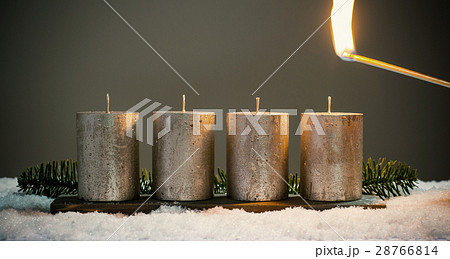 Light four advents candles with matches Light four advents candles with matches 28766814