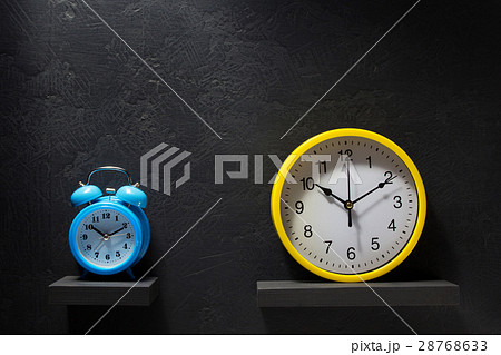 wall and alarm clock at black background wall and alarm clock at black background 28768633