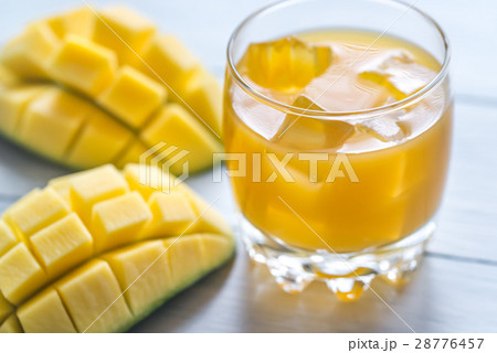 Mango juice on the wooden table Mango juice on the wooden table 28776457