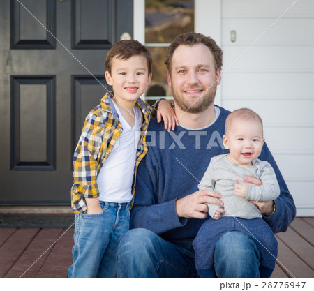 Mixed Race Father and Sons on Front Porch Mixed Race Father and Sons on Front Porch 28776947