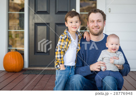 Mixed Race Father and Sons on Front Porch Mixed Race Father and Sons on Front Porch 28776948
