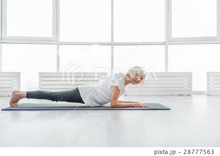 Happy mature lady doing exercise Happy mature lady doing exercise 28777563