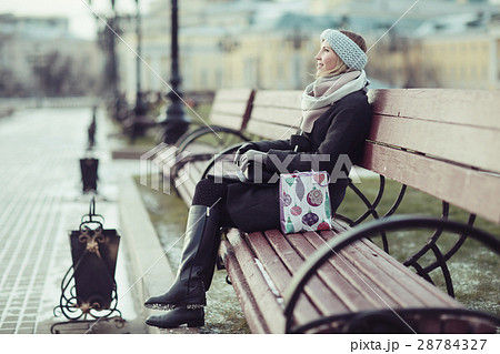 Dreaming woman in winter city a festive mood 28784327