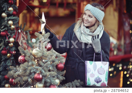 happy woman buys gifts for the new year 28784652