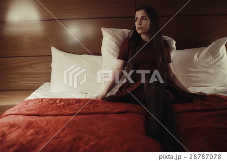 Young sexy woman on a bed in hotel Young sexy woman on a bed in hotel 28787078