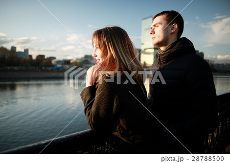 young couple at the park in winter view from the back 28788500