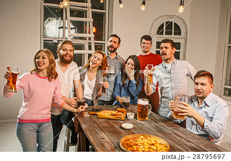 Group of friends enjoying evening drinks with beer 28795697