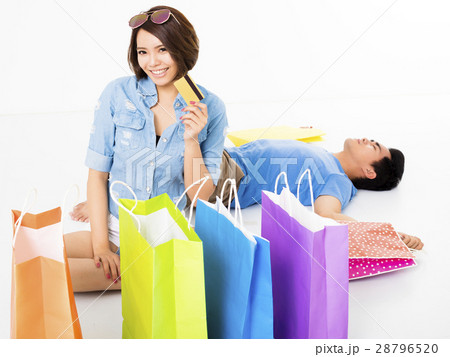 young Couple with shopping bags and credit card young Couple with shopping bags and credit card 28796520