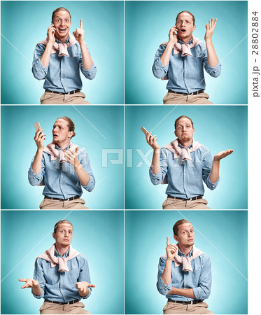 The surprised young man over blue background 28802884
