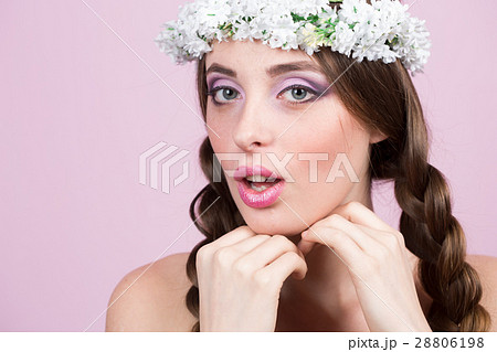 young model with bright flowers on her head young model with bright flowers on her head 28806198