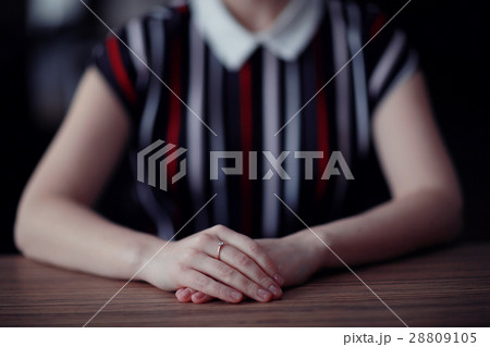 female hands sitting at the table waiting female hands sitting at the table waiting 28809105