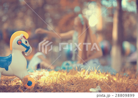 blurred background Mother and baby in the park, toys blurred background Mother and baby in the park, toys 28809899