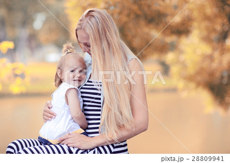 Mother hugging little daughter portrait 28809941